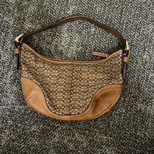 Coach vintage signature bag. Cleaned but used. Brown and leather straps.